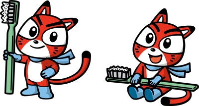 歯ブラシを持った赤い猫