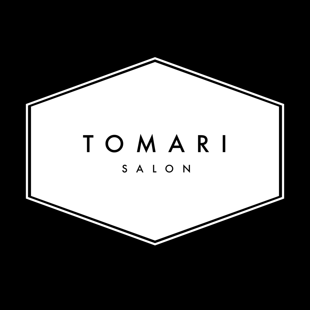 理容店「SALON TOMARI」のロゴ