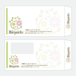 Design co.que (coque0033)さんの新会社「介護ショップ マーガレット」の封筒デザインへの提案