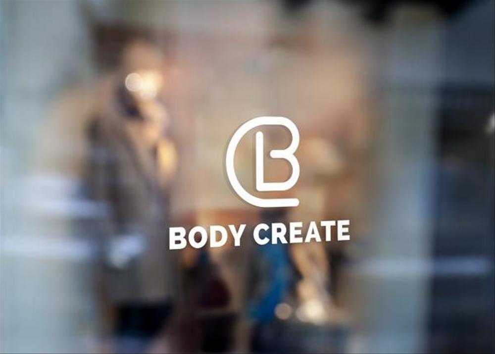 株式会社ネクストクリエイトのロゴとパーソナルトレーニングジム「BODY CREATE」のロゴ