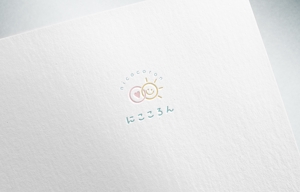 NINA DESIGN (NINA-DESIGN)さんのベビーマッサージ「にこころん」のロゴへの提案