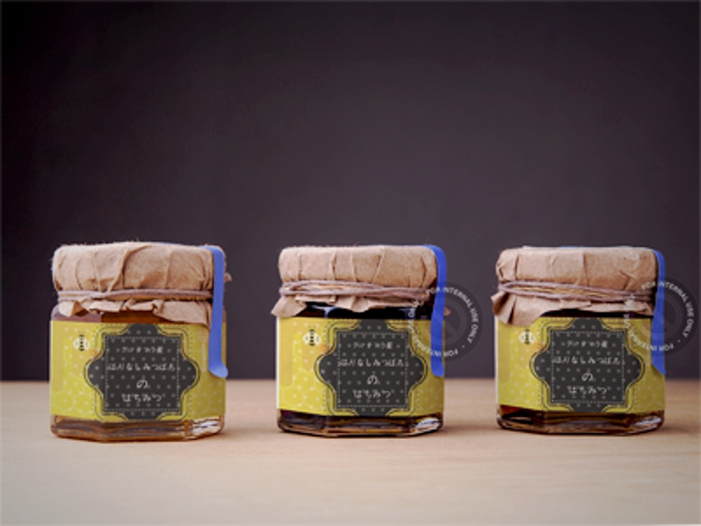 「グアテマラ産ハリナシミツバチのはちみつ」に貼付するラベルシールのデザイン